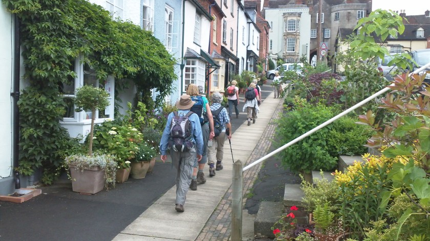 Group walking up Ludlow High Street near end of the walk.