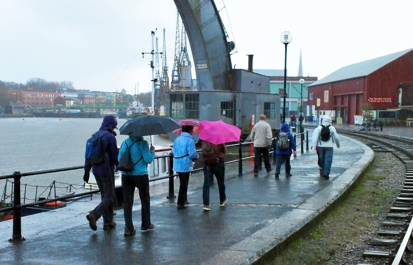 Group walking alongside the Bristol Harbour later in the walk.