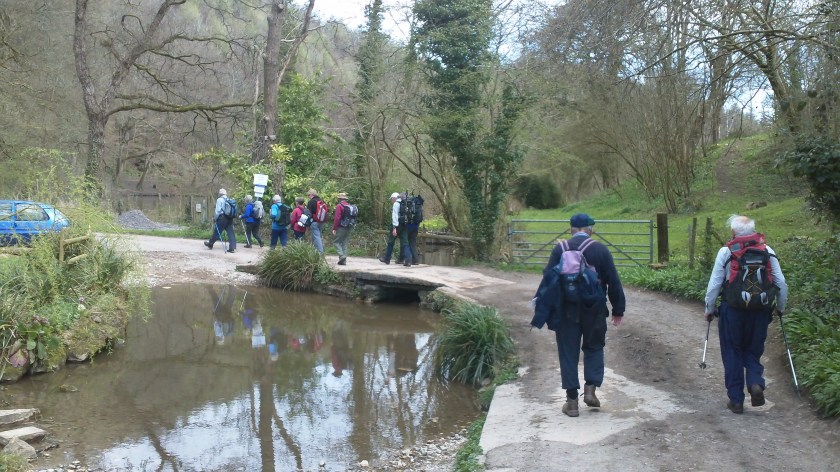 Group walking in the Toadsmoor Valley early in the walk