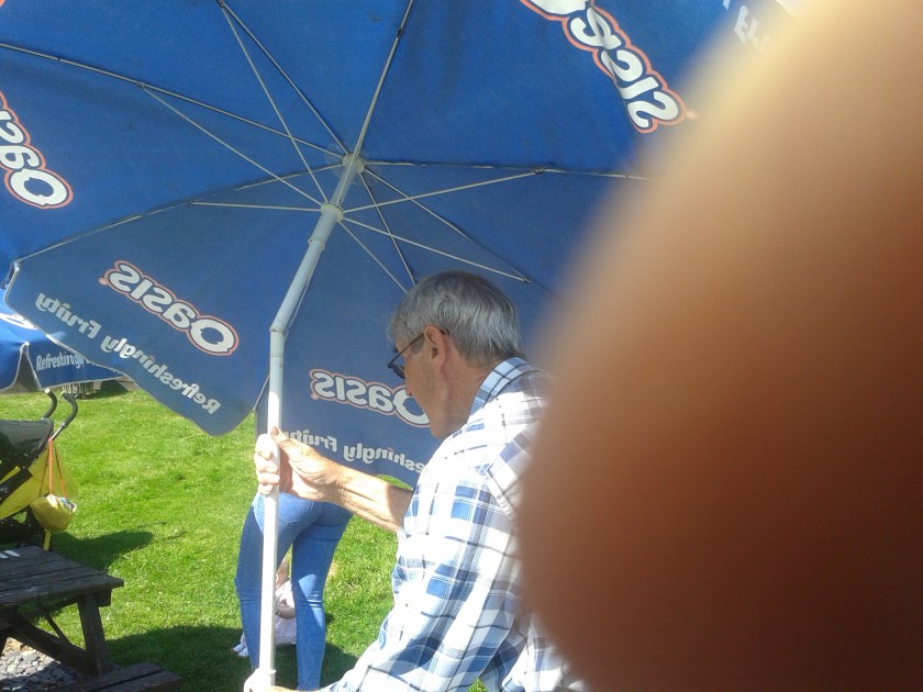 Gorgon is determined to get "air borne" using pub umbrella as his para-glider!