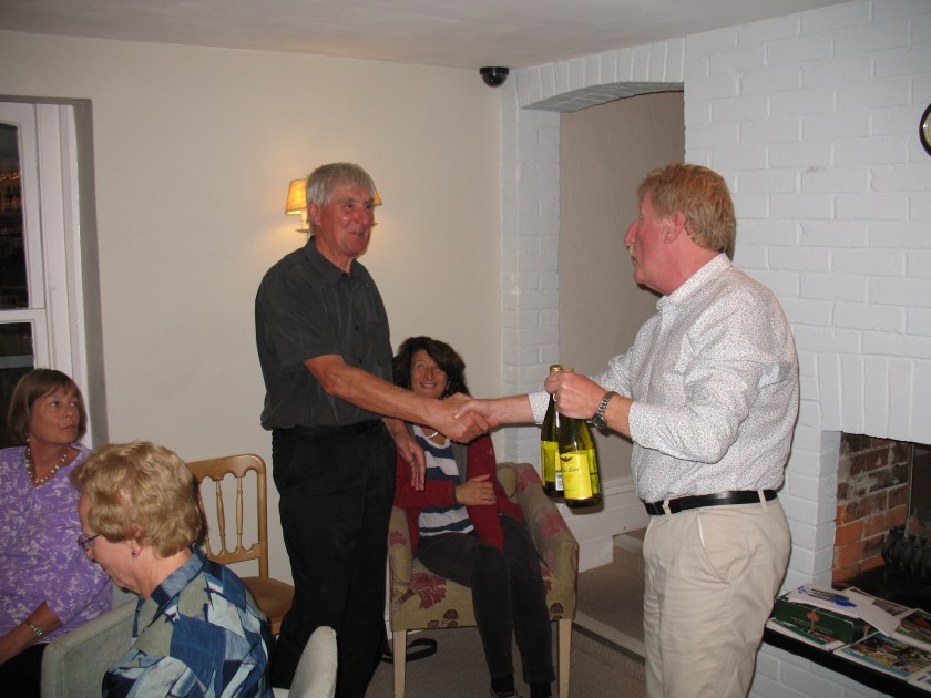 Neville presenting Walks Leader Chris with a bottle of wine as a thank you from the club.
