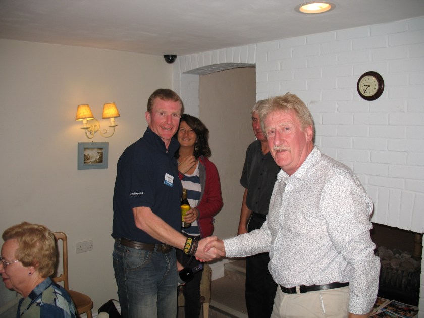 Presentation to walks leader Floss by Neville