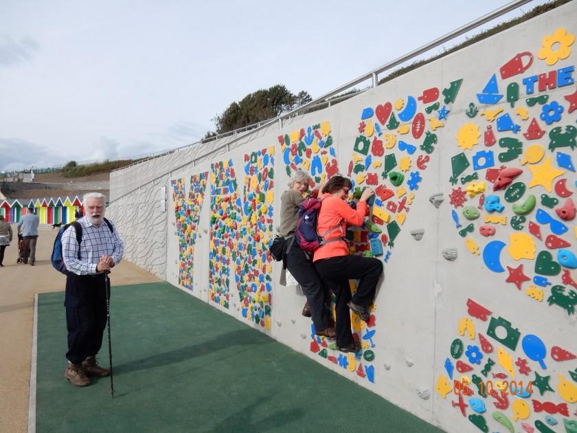 Janet and Alison try out the new climbing wall on the Barry sea front.