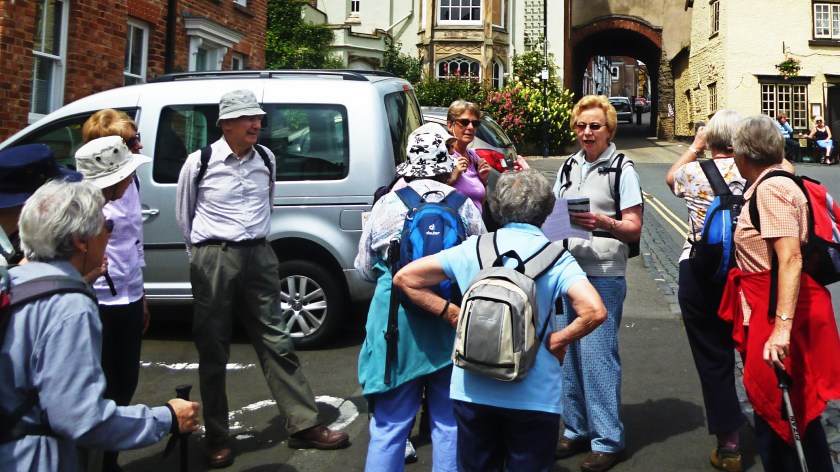 Group receiving a briefing from Davina